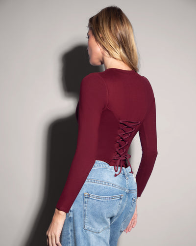 Model is in Long Sleeve Corsety Sculpting Shapewear Top - Dark Cherry back view