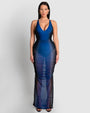 Model is wearing Ruched Sheer Side Slit Maxi Skirty - Midnight Ombre and matching color one piece swimsuit