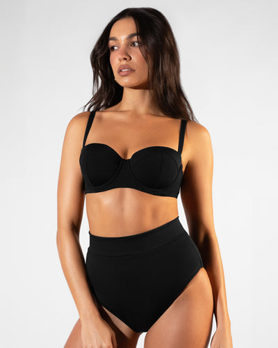 Front view of model in Bombshell Bikini Top - Black paired with Hi Cut Adjustable Kini Bottom - Black