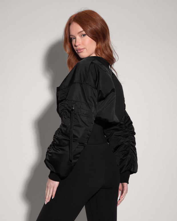Model is in Corsety Bomber Zipper Front Waist Shaping Jacket - Black side view