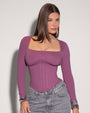 Model is posing in Corsety Square Neck Long Sleeve Sculpting Shapewear Top - Grape