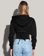 Model is posing in Corsety Long Sleeve Shapewear Hoodie - Black back view