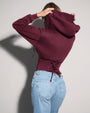 Model is wearing Corsety Long Sleeve Shapewear Hoodie - Dark Cherry back view