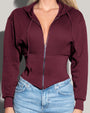 Model is wearing Corsety Long Sleeve Shapewear Hoodie - Dark Cherry close up front