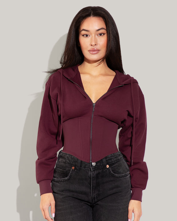 Model is wearing Corsety Long Sleeve Shapewear Hoodie - Dark Cherry