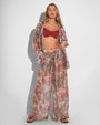 Model is posing in Flowy Pull On Wide Leg Pant - Cheeky Monkey and matching print long sleeve unbuttoned shirt front view