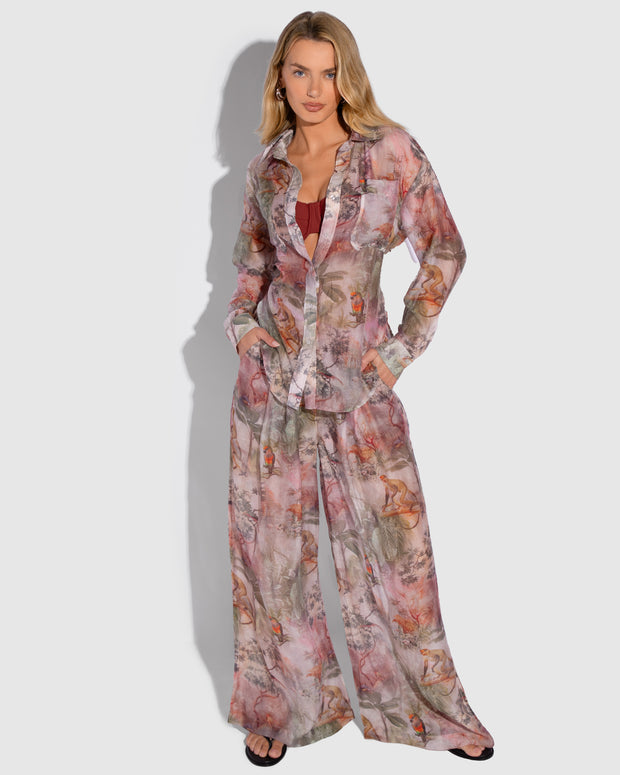 Model is posing in Flowy Pull On Wide Leg Pant - Cheeky Monkey and matching print long sleeve shirt front view
