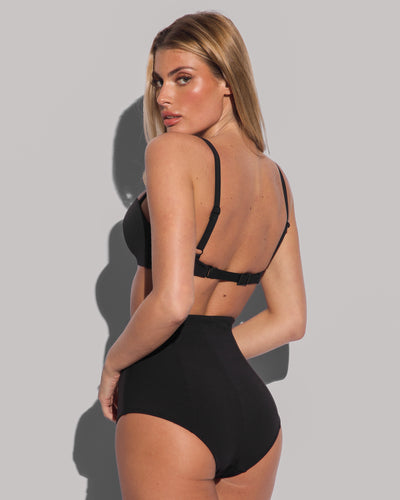 Model wears High Waisted Kini Bottom Shapewear Two Piece - Black and matching color wireless swim bra back view