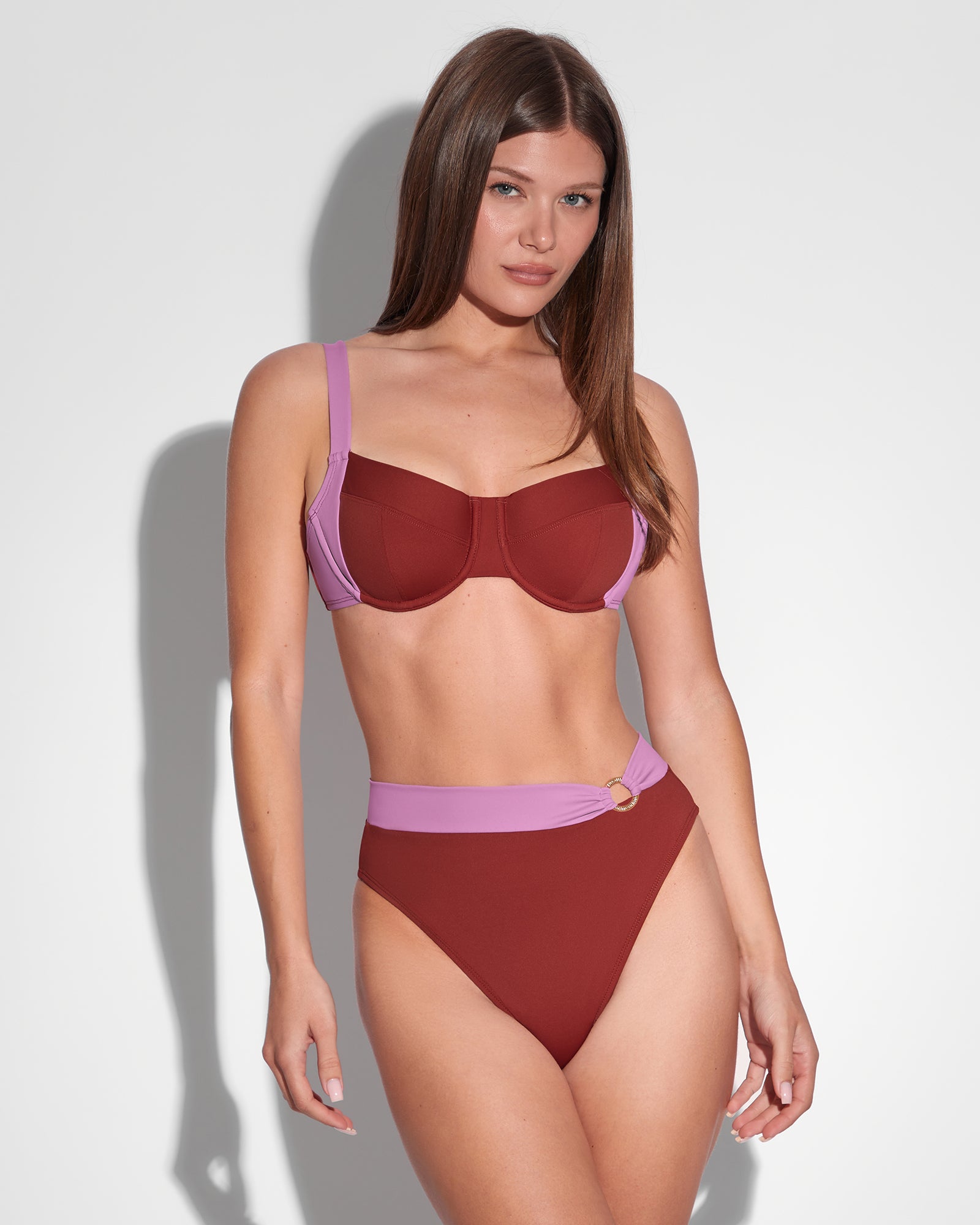 Model is wearing Lifty Shapewear Wide Strap Underwire Bikini Top - Copper/Lilac and matching swim top