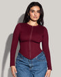Model is in Long Sleeve Corsety Sculpting Shapewear Top - Dark Cherry front view fully zipped