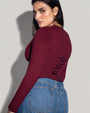 Model is in Long Sleeve Corsety Sculpting Shapewear Top - Dark Cherry side view