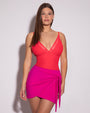 Model wears Meshy Low-Cut One Piece with Built-in Shapewear - Hot Coral with a mini wrap skirty full front view 