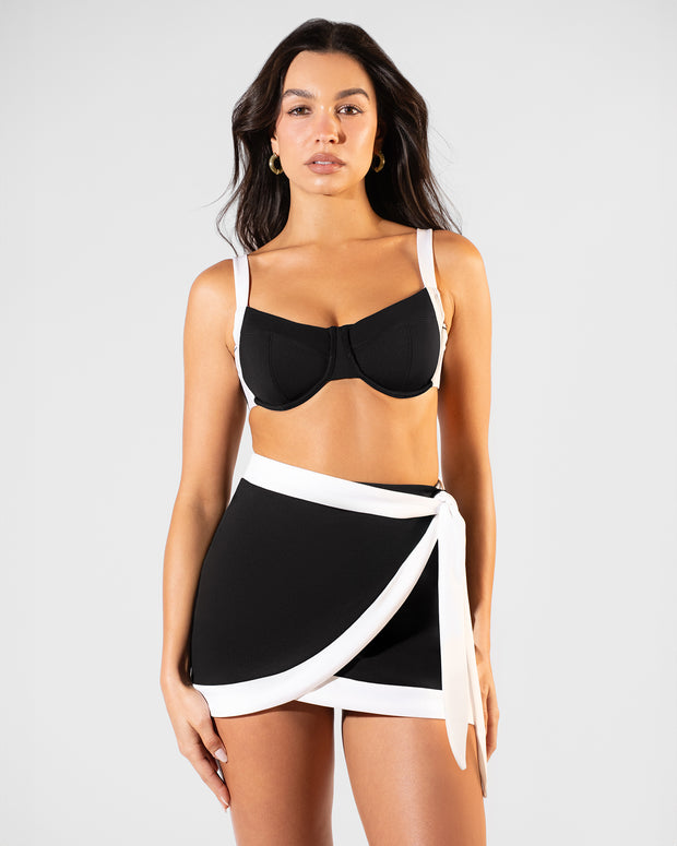 Model wearing Mini Wrap Skirty - Frame Black/White paired with Lifty Tie Back Bikini Top - Black White 