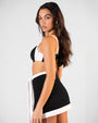 Back view of Mini Wrap Skirty - Frame Black/White on model