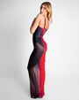 Model wears Ruched Sheer Side Slit Maxi Skirty - Red Ombre and matching color one piece swimsuit side view