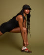 Model is posing in Sleeveless Surfy Shortie Sculpting Shapewear Swimsuit - Black side view