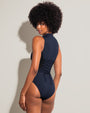 Model wears Sleeveless Surfy One Piece Shapewear Swimsuit - Midnight/Black back view
