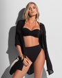 Model wearing Seersucker Gauze Flowy Shirt - Black unbuttoned all the way with bikini under
