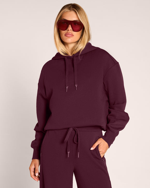 Model in Convertible Fleecey - Garnet worn as a mid-cropped length