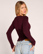 Three quarter back view of model in Corsety Long Sleeve Top - Lace Garnet/Garnet