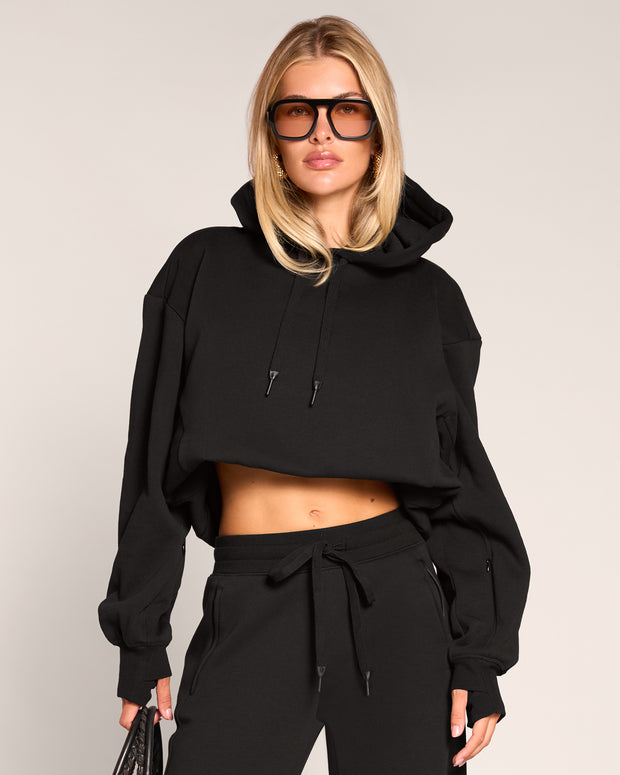 Model wearing Convertible Fleecey - Black cropped at the shortest length