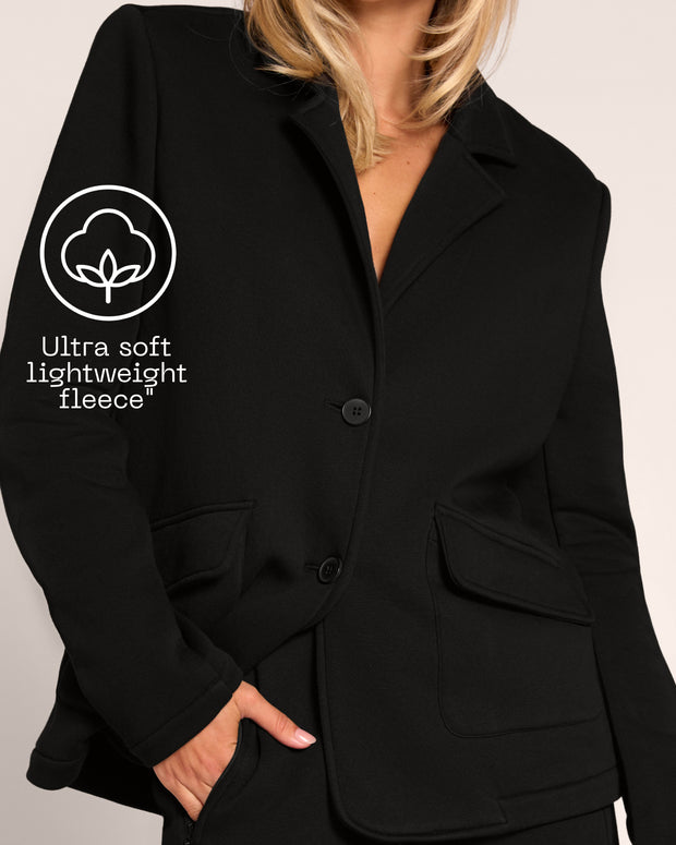 Graphic of Swuity Convertible Jacket - Black highlighting the ultra soft lightweight fleece fabric