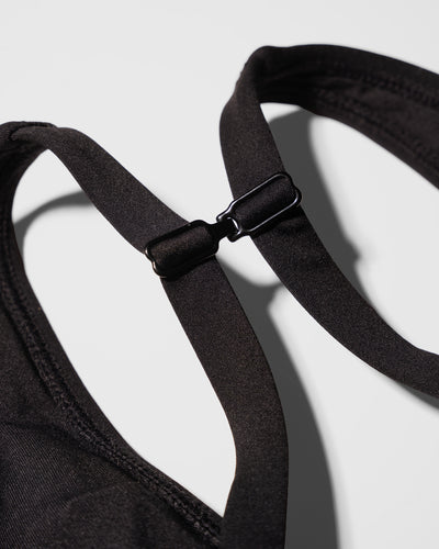 Close up flat lay of the racerback clip on Plungey - Black